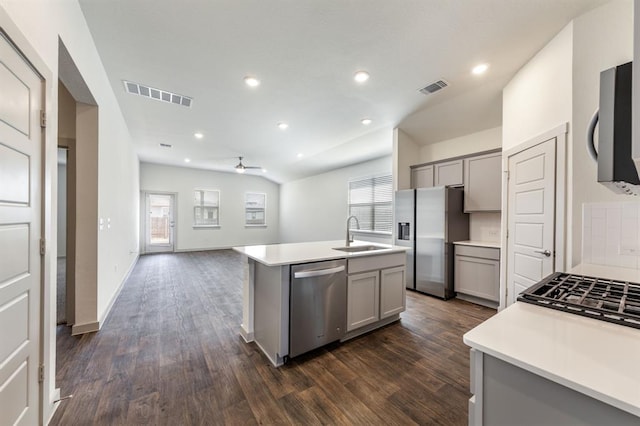 kitchen with gray cabinets, appliances with stainless steel finishes, and visible vents
