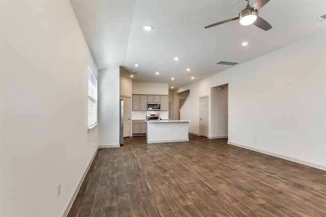 unfurnished living room featuring dark wood-style floors, recessed lighting, a ceiling fan, visible vents, and baseboards