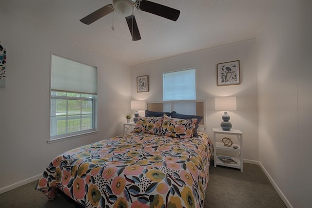 carpeted bedroom featuring a ceiling fan and baseboards