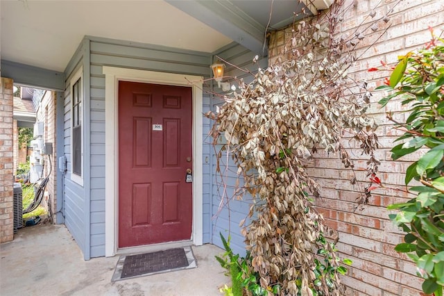 view of exterior entry featuring cooling unit