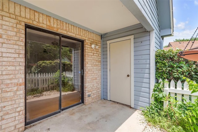 entrance to property with brick siding