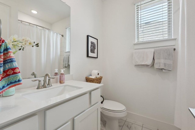 full bathroom featuring marble finish floors, toilet, vanity, and baseboards