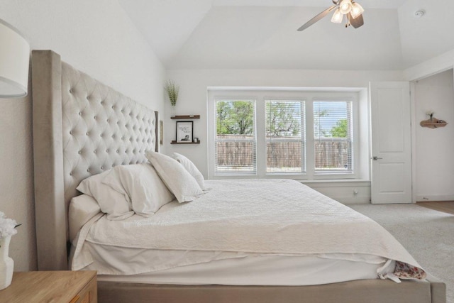 carpeted bedroom with lofted ceiling and ceiling fan