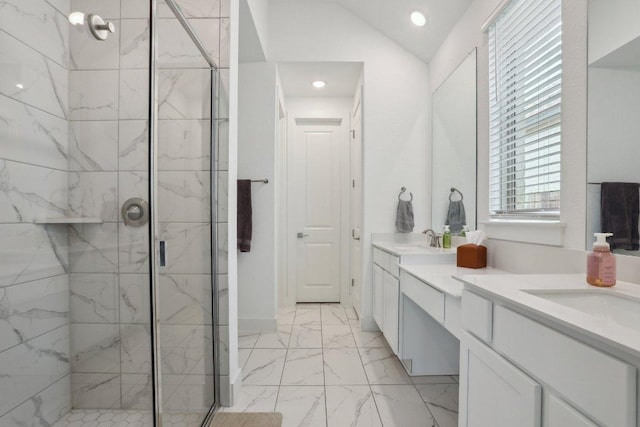 full bathroom with a marble finish shower, marble finish floors, recessed lighting, double vanity, and lofted ceiling