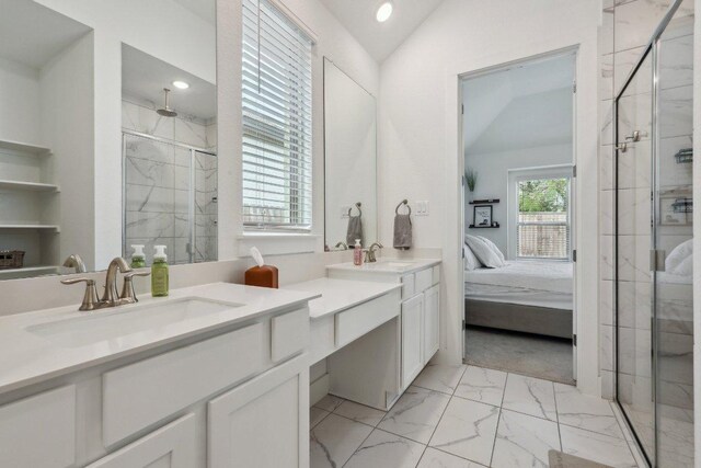 full bathroom with marble look tiles, a marble finish shower, lofted ceiling, double vanity, and recessed lighting
