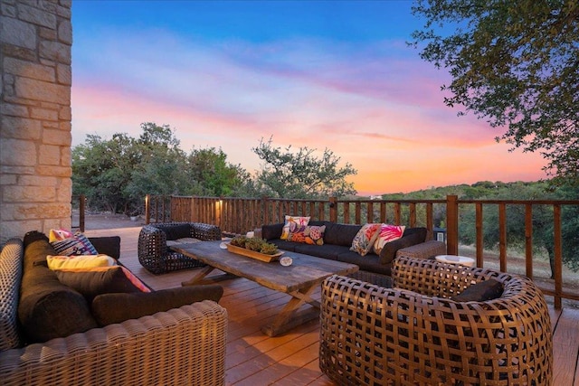 wooden terrace featuring an outdoor living space
