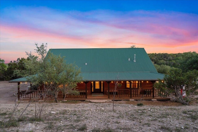 19801 Adrian Way, Jonestown, TX 78645 - log cabin with a porch, metal roof, and log siding
