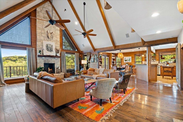 living room featuring high vaulted ceiling, plenty of natural light, ceiling fan, and hardwood / wood-style floors