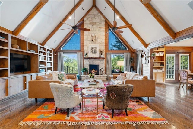 19801 Adrian Way, Jonestown, TX 78645 - living room with high vaulted ceiling, healthy amount of natural light, beam ceiling, hardwood / wood-style flooring, and a fireplace