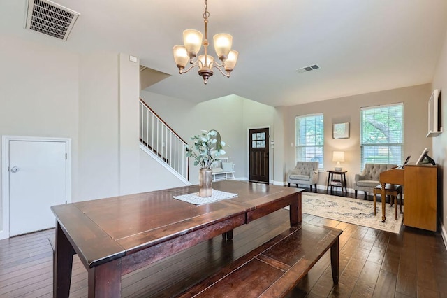 2106 Valerian Trl, Round Rock, TX 78665 - dining room with stairway, dark wood-type flooring, and a chandelier