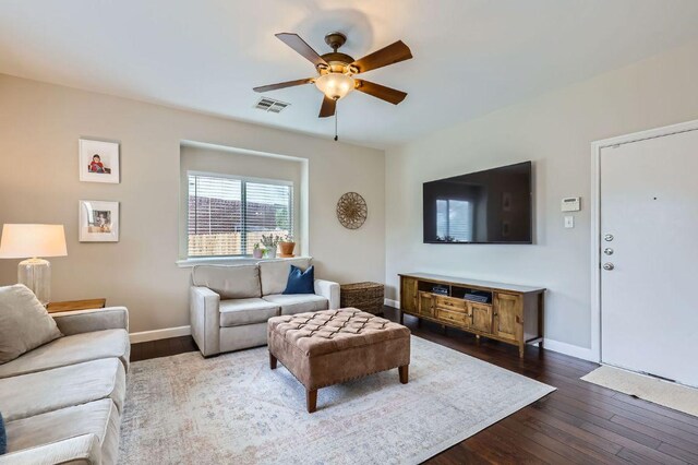 2106 Valerian Trl, Round Rock, TX 78665 - living area featuring ceiling fan, dark wood-type flooring, and baseboards