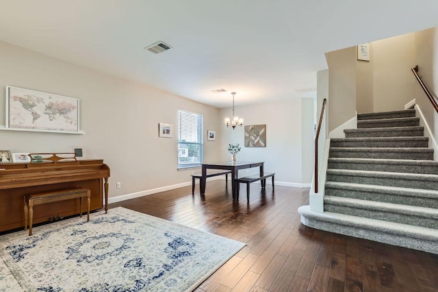 2106 Valerian Trl, Round Rock, TX 78665 - entryway featuring a chandelier, stairs, dark wood finished floors, and baseboards