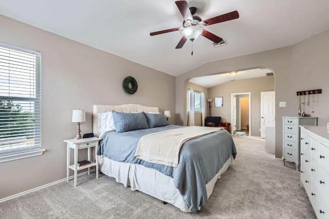 2106 Valerian Trl, Round Rock, TX 78665 - bedroom featuring arched walkways, light colored carpet, ceiling fan, and lofted ceiling