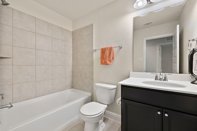 1051 Kenney Fort Xing Unit 73, Round Rock, TX 78665 - full bath with toilet, tile patterned floors, vanity, a textured wall, and baseboards