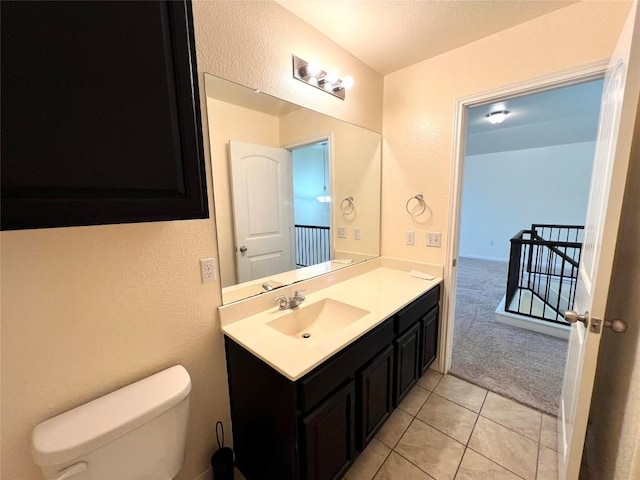 1404 Elbe St, Pflugerville, TX 78660 - bathroom with vanity, tile patterned flooring, and a textured wall