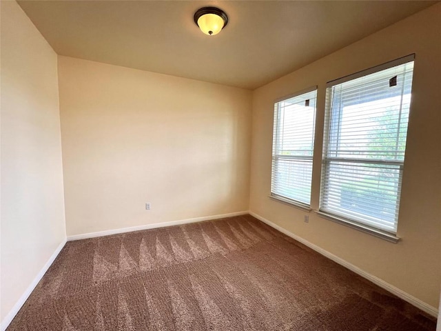 1404 Elbe St, Pflugerville, TX 78660 - unfurnished room with dark carpet and baseboards