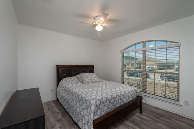 bedroom featuring wood finished floors and ceiling fan