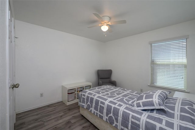 bedroom with ceiling fan and wood finished floors
