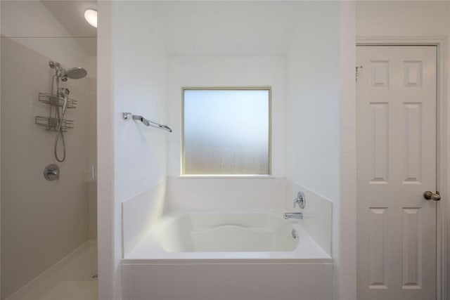 bathroom with a garden tub and a stall shower