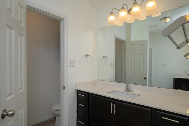 full bath with vanity and toilet