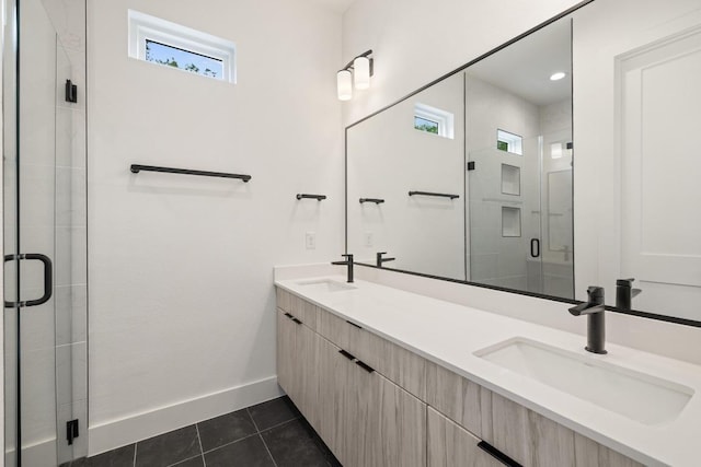 590 Old Mill Rd Unit 113, Cedar Park, TX 78613 - bathroom with double vanity, a stall shower, tile patterned floors, and baseboards