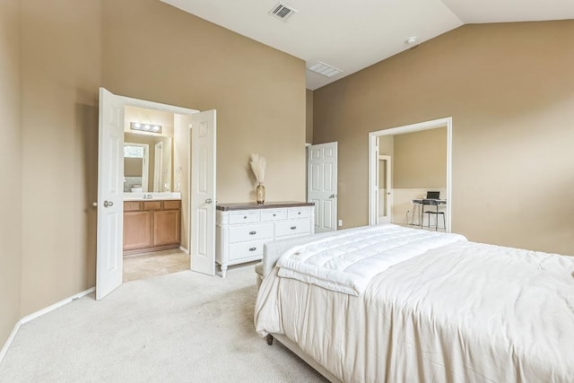 bedroom featuring light colored carpet, visible vents, baseboards, connected bathroom, and lofted ceiling