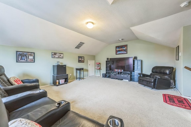 carpeted living area featuring visible vents, baseboards, and lofted ceiling