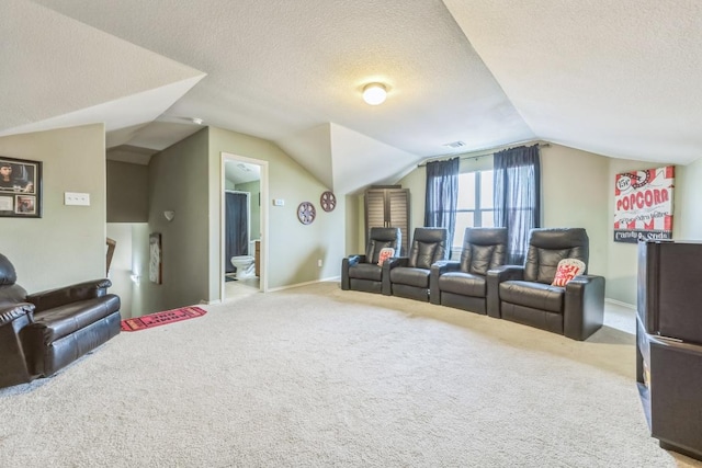 living area with carpet floors, a textured ceiling, and vaulted ceiling