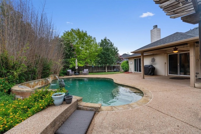 view of swimming pool featuring area for grilling, ceiling fan, a patio area, a fenced in pool, and a fenced backyard