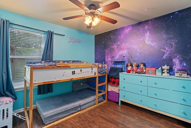 bedroom with ceiling fan and wood finished floors