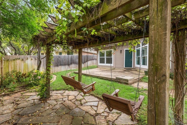 view of yard featuring a patio, fence, french doors, and a pergola