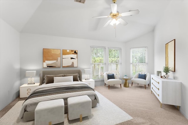 carpeted bedroom with a ceiling fan and vaulted ceiling