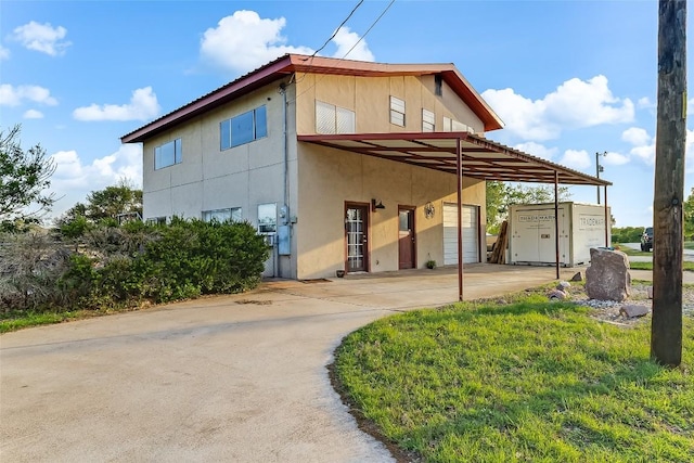 288 Ballard St, Tow, TX 78672 - exterior space with a garage and stucco siding