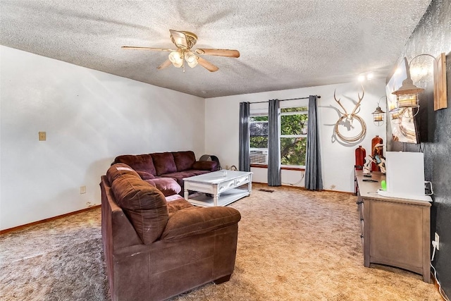 288 Ballard St, Tow, TX 78672 - living room featuring carpet floors, a ceiling fan, a textured ceiling, and baseboards