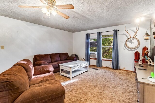 288 Ballard St, Tow, TX 78672 - living room featuring ceiling fan, light colored carpet, a textured ceiling, and visible vents