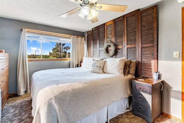 288 Ballard St, Tow, TX 78672 - bedroom featuring a textured wall, baseboards, ceiling fan, a textured ceiling, and carpet