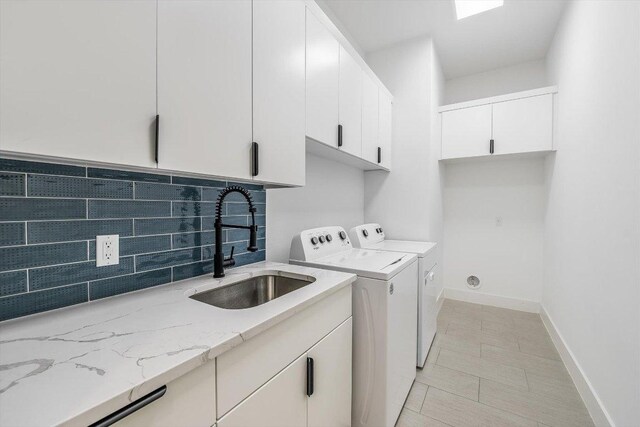 1105 Lipan Trl, Austin, TX 78733 - washroom with cabinet space and washing machine and dryer