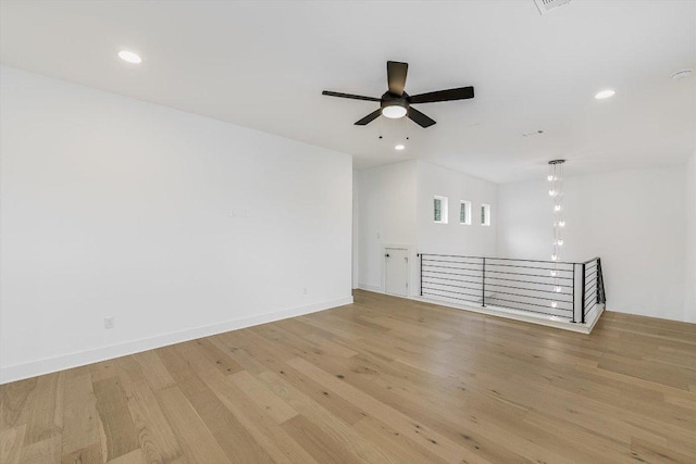 1105 Lipan Trl, Austin, TX 78733 - unfurnished room with light wood-style floors, a ceiling fan, and recessed lighting