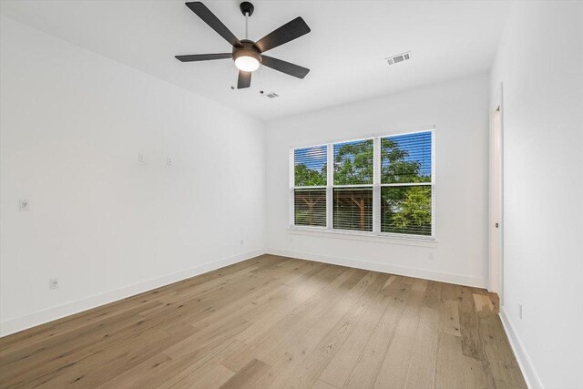 1105 Lipan Trl, Austin, TX 78733 - empty room featuring light wood-style floors and ceiling fan