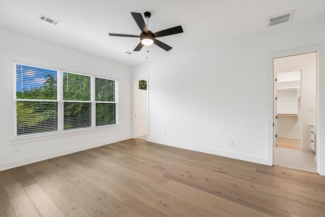 1105 Lipan Trl, Austin, TX 78733 - empty room with light wood-type flooring and a ceiling fan