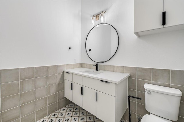 1105 Lipan Trl, Austin, TX 78733 - bathroom with tile walls, vanity, and wainscoting