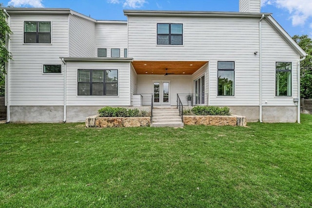 1105 Lipan Trl, Austin, TX 78733 - rear view of house featuring a lawn and a chimney
