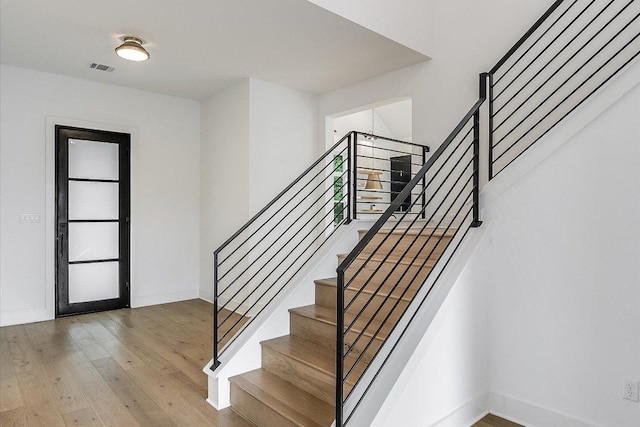 1105 Lipan Trl, Austin, TX 78733 - entrance foyer featuring wood finished floors and stairway