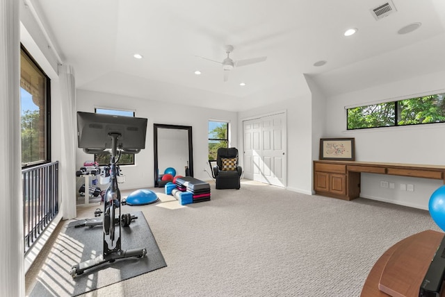 exercise area featuring built in desk, recessed lighting, visible vents, and a healthy amount of sunlight