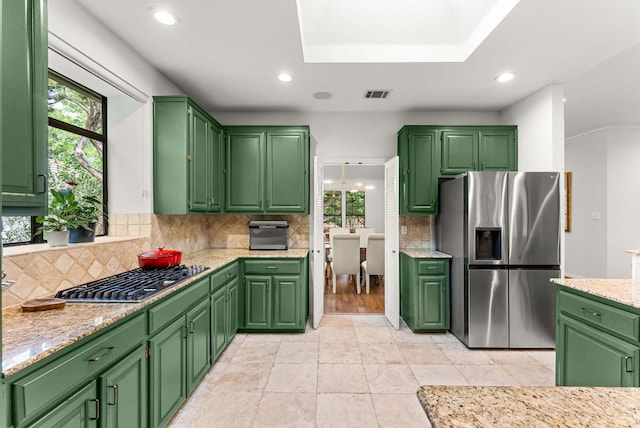 kitchen with recessed lighting, appliances with stainless steel finishes, decorative backsplash, and visible vents