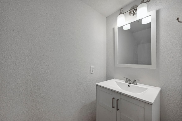1815 River Crossing Cir Unit A, Austin, TX 78741 - bathroom featuring vanity and a textured wall