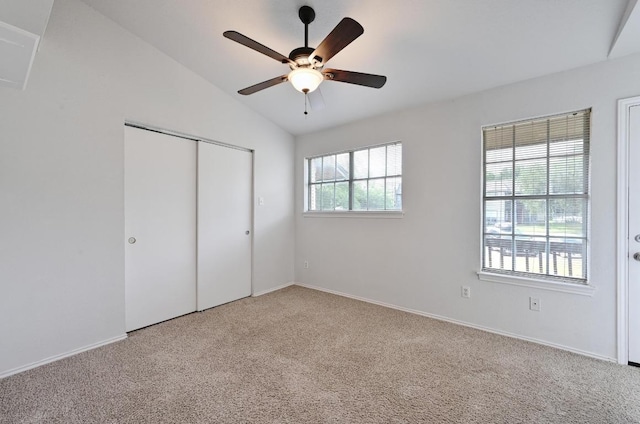 1815 River Crossing Cir Unit A, Austin, TX 78741 - unfurnished bedroom with carpet, lofted ceiling, a closet, ceiling fan, and baseboards