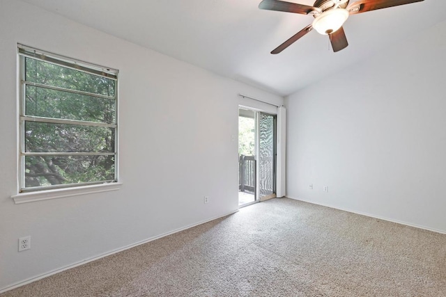 1815 River Crossing Cir Unit A, Austin, TX 78741 - carpeted spare room featuring ceiling fan, vaulted ceiling, and baseboards