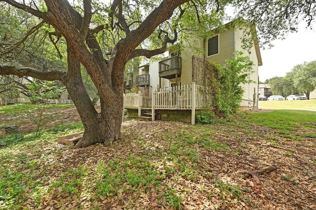 1815 River Crossing Cir Unit A, Austin, TX 78741 - view of yard with a balcony and a wooden deck