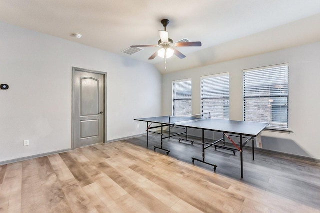 playroom with baseboards, ceiling fan, visible vents, and wood finished floors